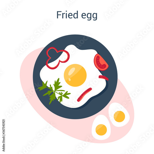 Tasty fried eggs with papper and parsley for breakfast. Scrambled