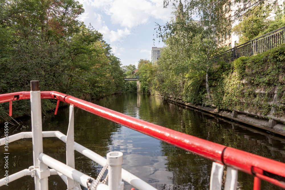 By boat on the Karl Heine Kanal in Leipzig. Saxony. Germany. This is a wonderful place for water sports