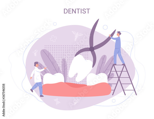 Group of small dentists in uniform treat giant tooth using medical photo