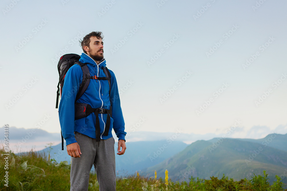 Man hiking in the mountains on a summer day