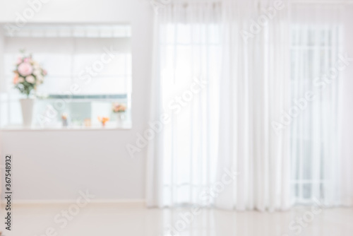 Blurred background atmosphere front room light shining through the curtain in home
