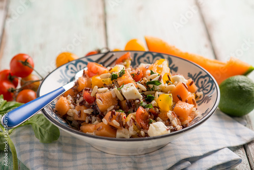 rice salad with black rice melon mozzarella and tomatoes