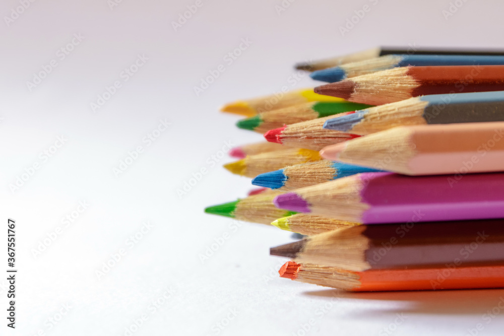 Colored pencils on a light background Colored pencils on a light background