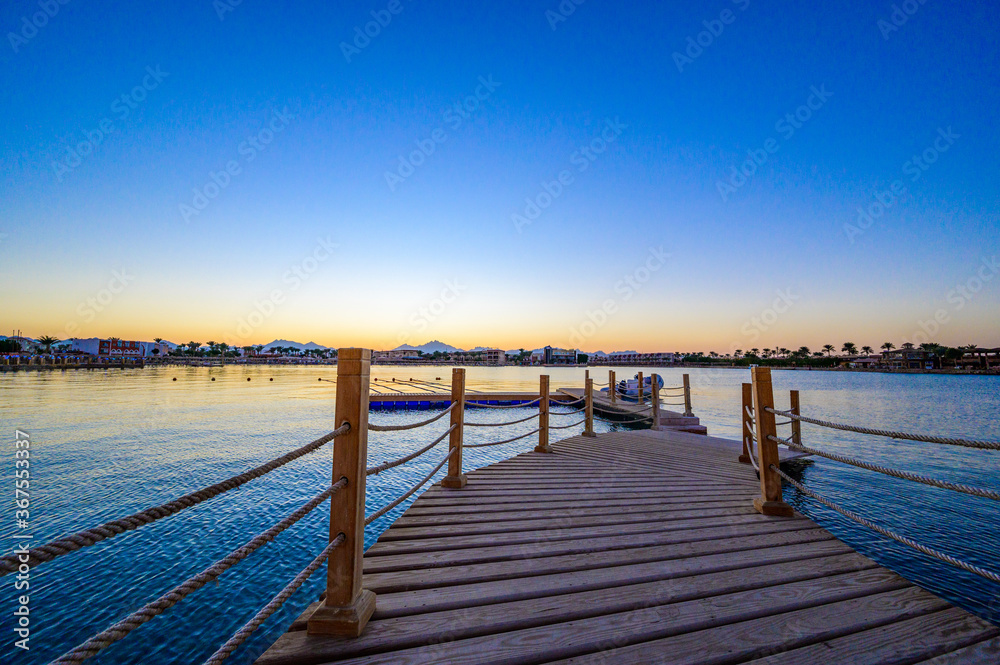 Fototapeta premium Wooden Pier on Red Sea in Hurghada at sunset, Egypt - travel destination in Africa