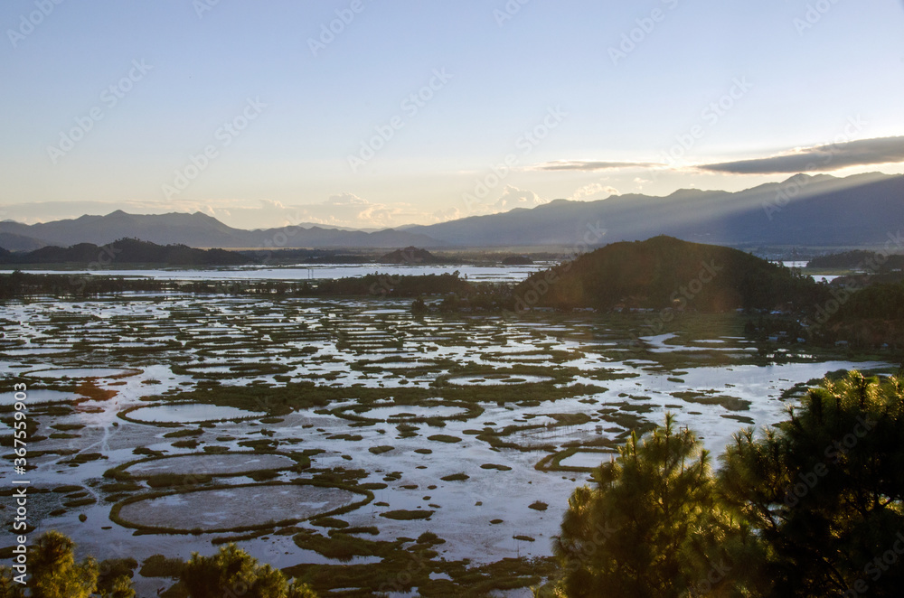 sunset in the mountains and aerial view of loktak lake