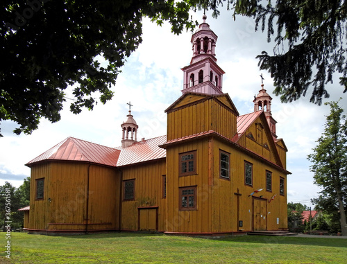 built in 1894, a wooden Catholic church dedicated to Saint Anna in the village of dąbrowka in mazovia, poland photo