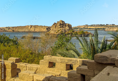 A view from the temple on Philae Island towards Bigeh island in the Nile near Aswan, Egypt in summer photo