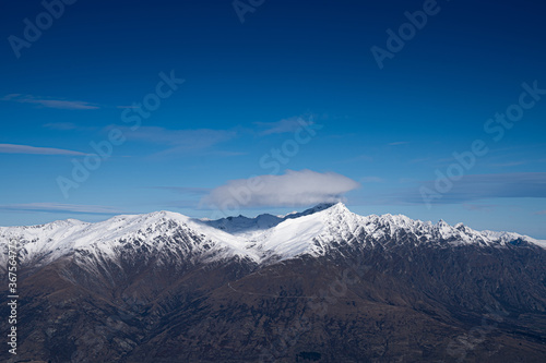 Winter landscape of snow mountain against blue sky in South island  New Zealand.