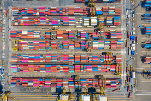 Container , container ship in export and import business and logistics. Shipping cargo to harbor by crane. Water transport International. Aerial view and top view.