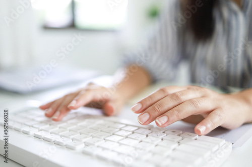  Hands typing on  keyboard. writing a blog. woman hands on the keyboard Working at home © Charlie's