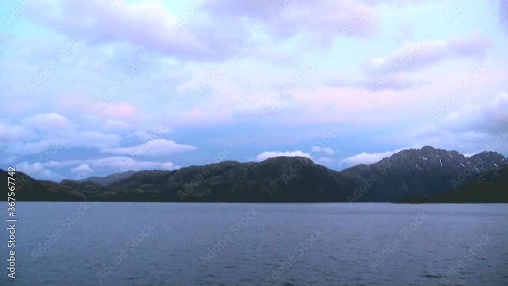Cruising Beagle Channel - Evening mood above Beagle Channel, Tierra del Fuego, Chile - Antarctica Cruise - Travel Destination Cruising Beagle Channel - Evening mood above Beagle Channel, Tierra del Fuego, Chile - Antarctica Cruise - Travel Destination