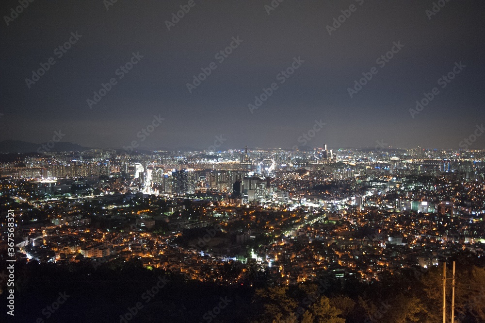 Beautiful scenery of an illuminated cityscape at night in Namsan, Seoul