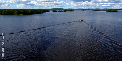 Finnish summer landscape. View of lake Päijanne from Kärkinen bridge. Motor boat on the second largest lake in Finland. photo