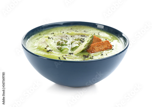 Delicious asparagus soup with rusks and sesame seeds isolated on white