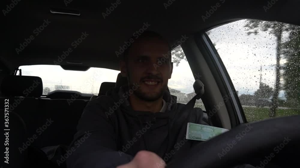 Happy driver with big money euro. Success. Concept on the business success, topic of lottery, winnings, slot machines. Happy driver with big money euro. Success. Concept on the business success, topic of lottery, winnings, slot machines.