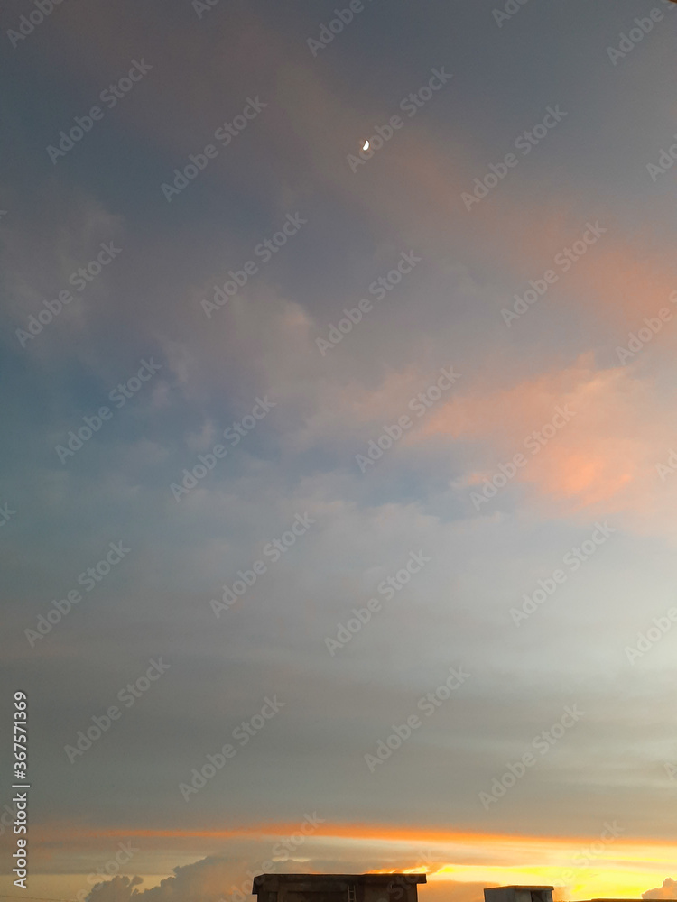 A picturesque & clear sky with the moon in the frame. A picturesque & clear sky with the moon in the frame.
