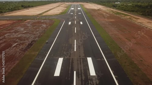 Point of view or POV of plane landing at runway of Panglao International Airport. A damp tarmac. Simulating arrival of airplane. photo