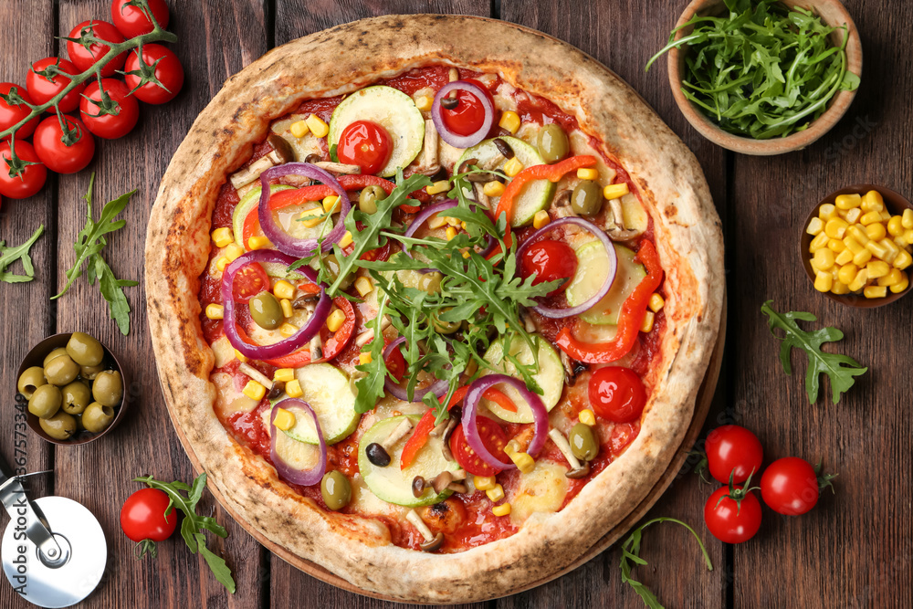 Flat lay composition with vegetable pizza on wooden table
