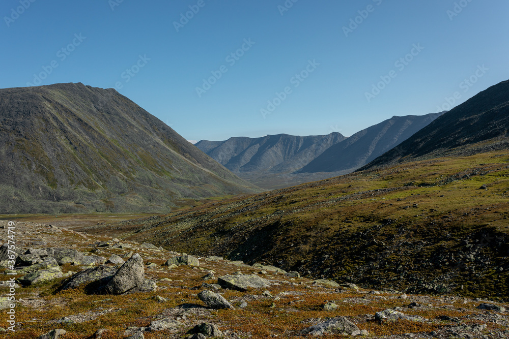 The concept of outdoor activities in the mountains. Minimalist mountain landscape. Atmospheric view. The majestic nature of the Circumpolar Urals. The concept of outdoor activities in the mountains. Minimalist mountain landscape. Atmospheric view. The majestic nature of the Circumpolar Urals.