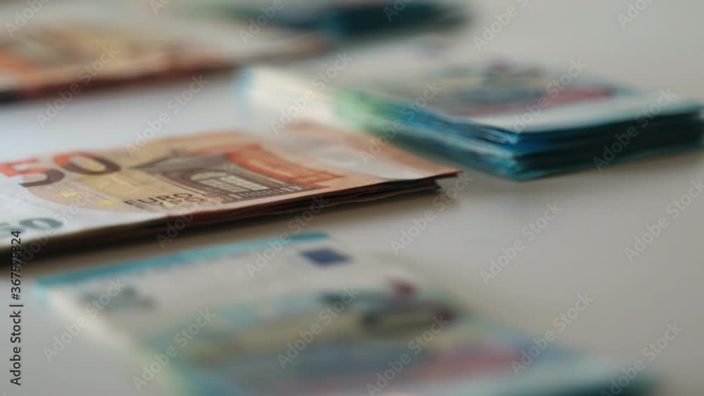 Concept of business and money, great earnings and financial transactions. Piles of euro banknotes on white background, cash savings for future investments Concept of business and money, great earnings and financial transactions. Piles of euro banknotes on white background, cash savings for future investments