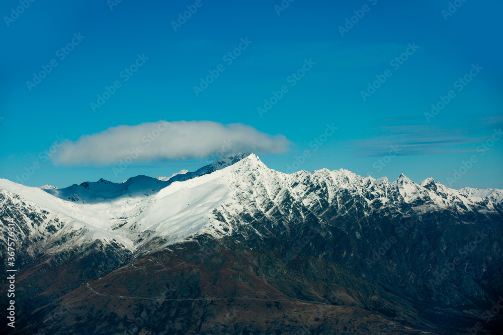 Winter landscape of snow mountain against blue sky in South island, New Zealand.