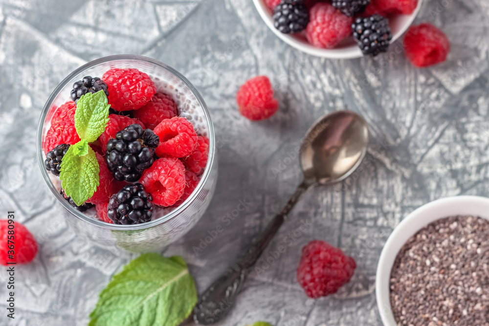 Vegan healthy food. Chia pudding with coconut milk, fresh raspberries and blackberries Vegan healthy food. Chia pudding with coconut milk, fresh raspberries and blackberries