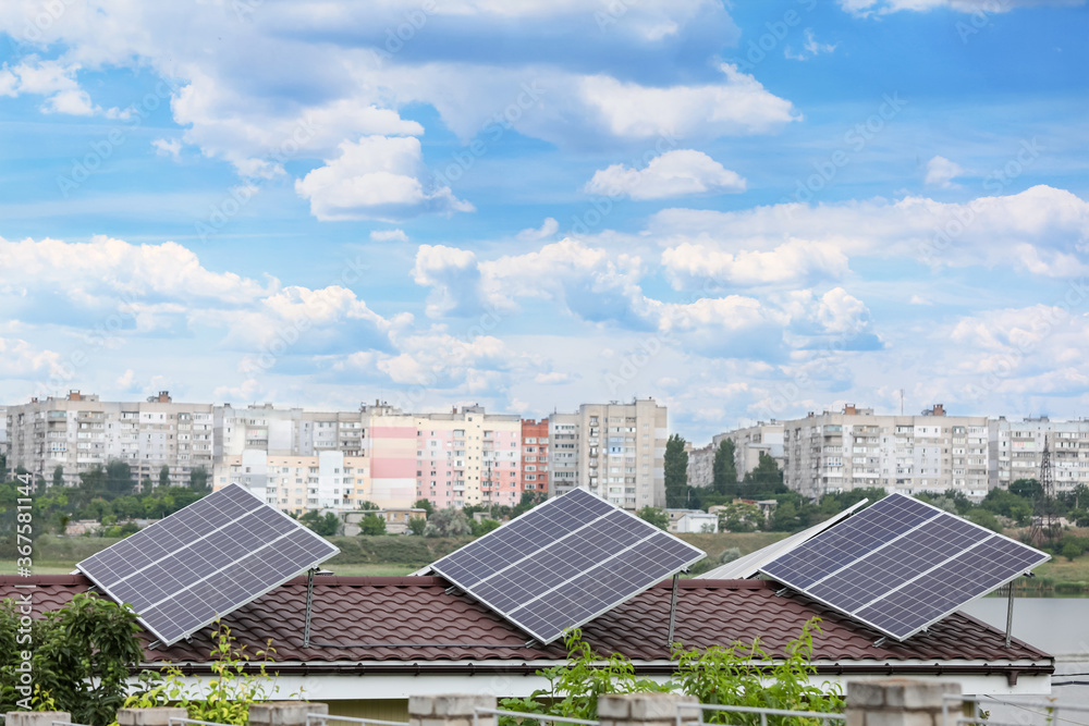 House with installed solar panels on roof. Alternative energy source House with installed solar panels on roof. Alternative energy source