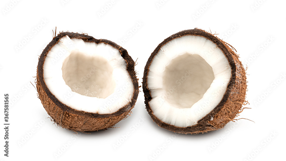 A broken coconut on a white background. Halves of coconut. Macro photo. High quality photo