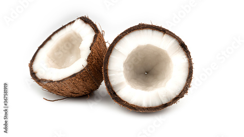 A broken coconut on a white background. Halves of coconut. Macro photo. High quality photo