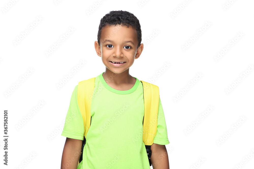 Young African American school boy with backpack on white background Young African American school boy with backpack on white background