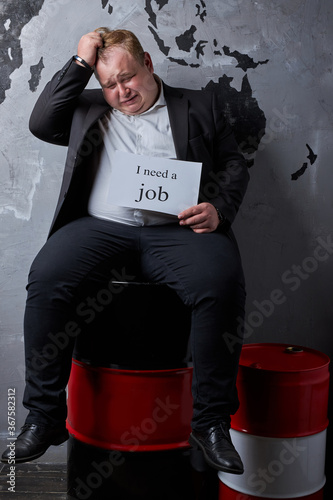 ruined caucasian oilman lost his job, fat guy in formal wear looking for new job, he is depressed