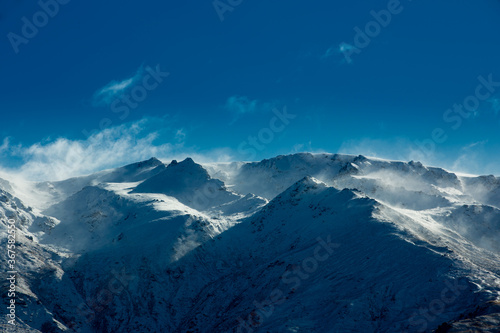 Winter landscape of snow mountain against blue sky in South island, New Zealand.