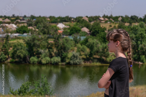 The girl admires the beautiful view of the banks of the Dnieper. Travel healthy lifestyle