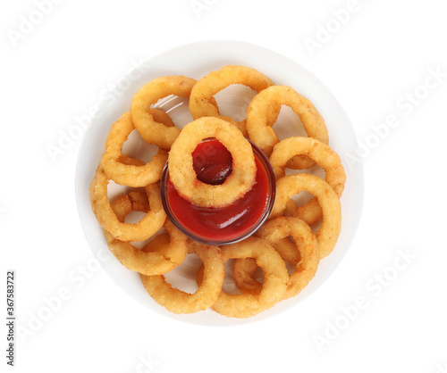 Delicious golden onion rings with ketchup isolated on white, top view photo