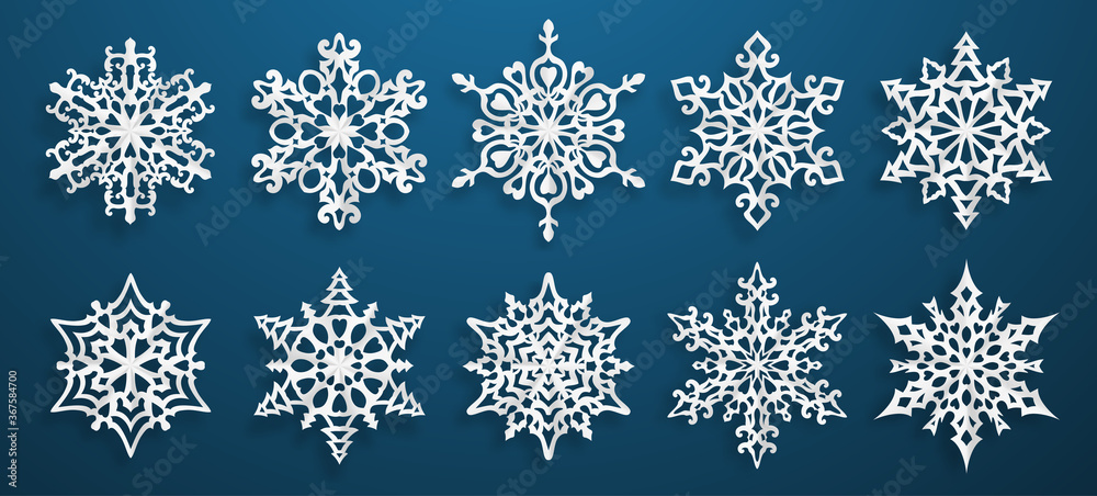 Set of beautiful complex paper Christmas snowflakes with soft shadows, white on blue background Set of beautiful complex paper Christmas snowflakes with soft shadows, white on blue background