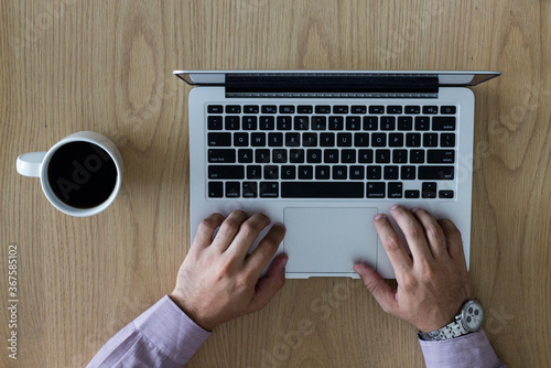 Young boy with a notebook and a cup of coffee