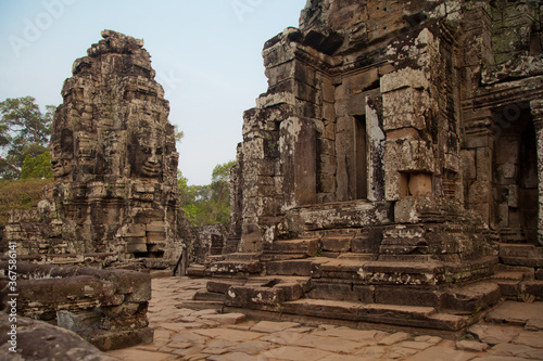 Stone murals and sculptures at Bayon Temple in daylight, Angkor Wat, Cambodia