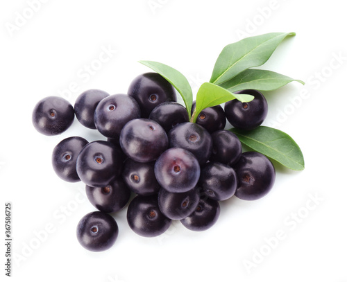 Pile of fresh acai berries with leaves isolated on white, top view