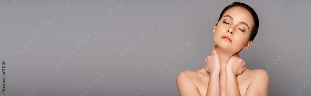 beautiful naked woman with perfect skin and closed eyes touching neck isolated on grey, panoramic shot beautiful naked woman with perfect skin and closed eyes touching neck isolated on grey, panoramic shot