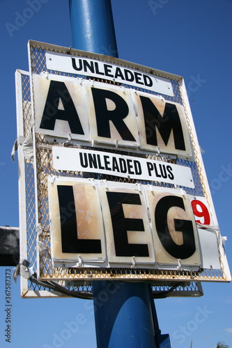 High Gas Price, Arm and Leg Sign Displayed at a Service Station During Painful Expensive Cost