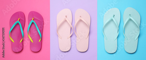 Flat lay composition with flip flops on color background. Beach objects