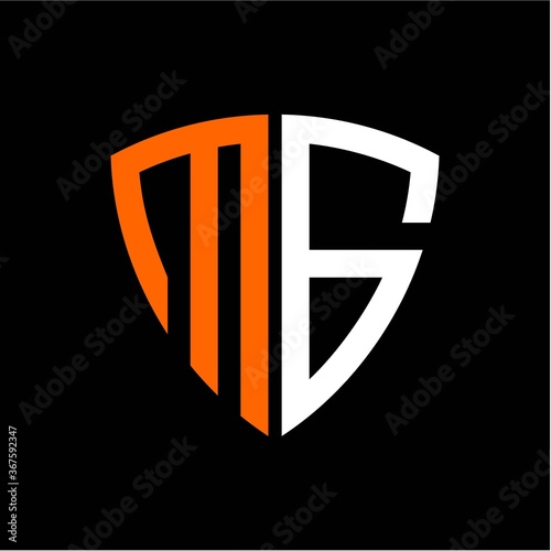M G initials white orange shield with black background