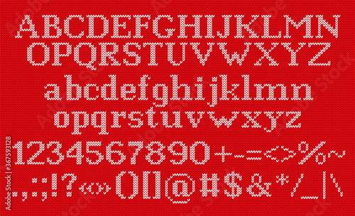 Knit font. Christmas typeface on seamless knitted pattern. Vector. Latin alphabet. Letters, numbers, signs and symbols on wool texture. Xmas ugly background. Retro red white illustration. Jumper print