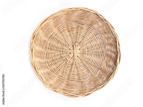 Above of woven bamboo basket isolated on white background.