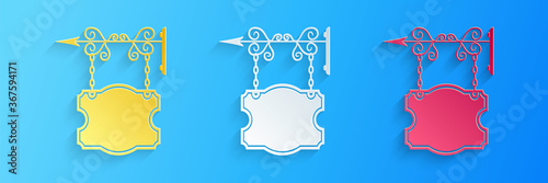 Paper cut Vintage street signboard hanging on forged brackets icon isolated on blue background. Suitable for advertisements bar, cafe, pub, restaurant. Paper art style. Vector.