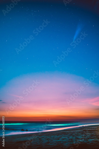 Concept  Serendipity. Neowise Comet. Sunset over the beach.