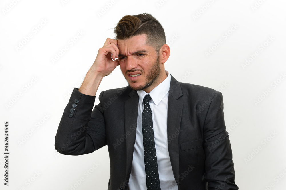 Portrait of handsome bearded Hispanic businessman in suit Portrait of handsome bearded Hispanic businessman in suit