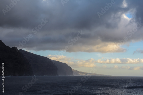 Bad weather seascape with cloudy sky and water wave.