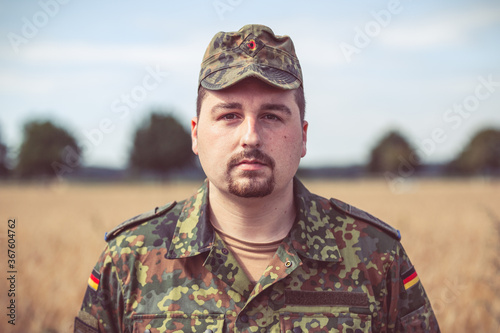 German soldier portrait in front of an field