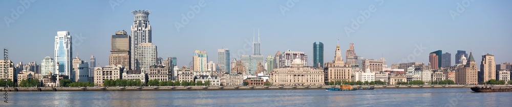 Shanghai, China - April 19, 2018: Large panorama of the Bund. One of the landmarks of Shanghai with several historical buidlings and a long waterfront promenade.